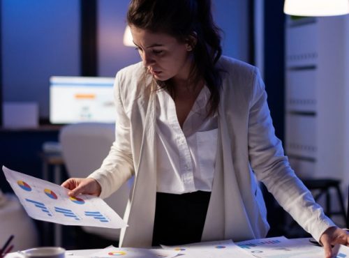 busy-business-woman-working-financial-reports-checking-numbers-executive-meeting